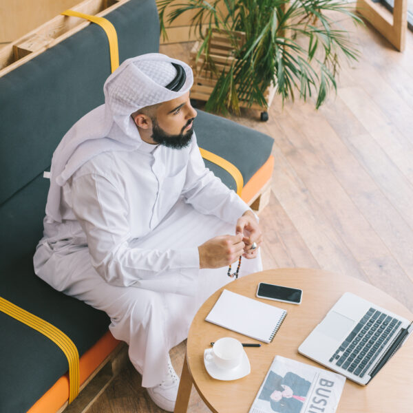 Top view of muslim businessman sitting on sofa wit 2023 11 27 05 12 38 utc 600x600